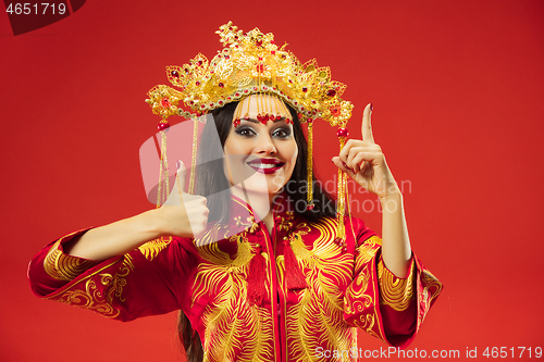 Image of Chinese traditional woman. Beautiful young girl wearing in national costume