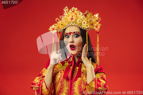 Image of Chinese traditional woman. Beautiful young girl wearing in national costume