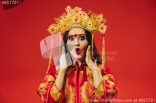 Image of Chinese traditional woman. Beautiful young girl wearing in national costume