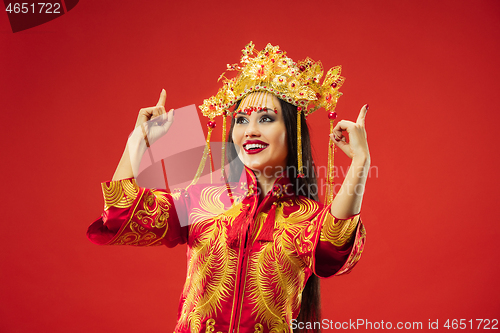 Image of Chinese traditional woman. Beautiful young girl wearing in national costume