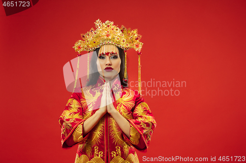 Image of Chinese traditional woman. Beautiful young girl wearing in national costume