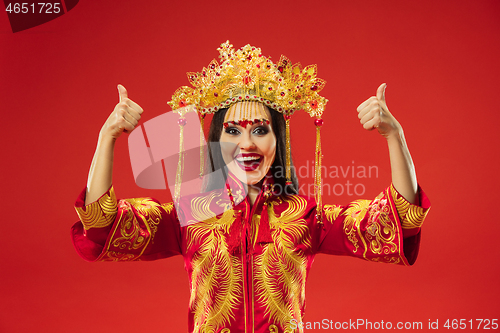 Image of Chinese traditional woman. Beautiful young girl wearing in national costume