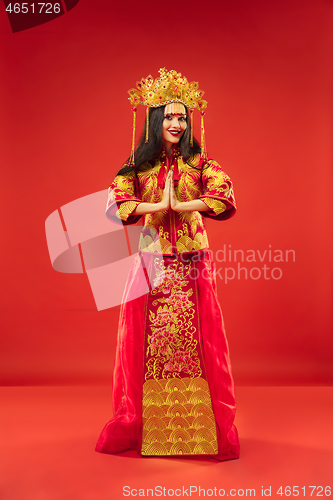 Image of Chinese traditional woman. Beautiful young girl wearing in national costume