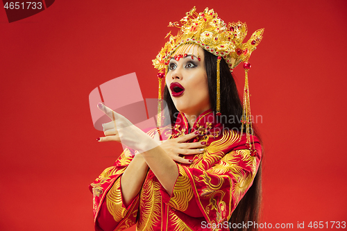 Image of Chinese traditional woman. Beautiful young girl wearing in national costume