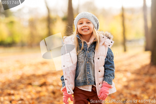 Image of happy girl at autumn park