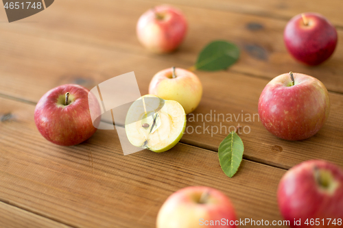 Image of ripe red apples on wooden table