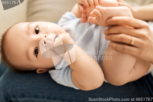 Image of close up of little asian baby boy and mother