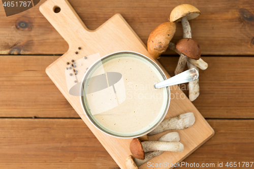 Image of mushroom cream soup in bowl on cutting board