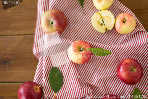 Image of ripe red apples on wooden table