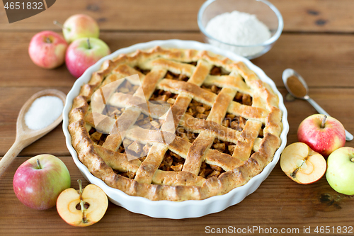 Image of close up of apple pie on wooden table