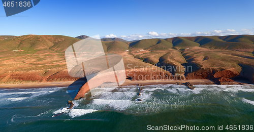 Image of Legzira beach with arched rocks