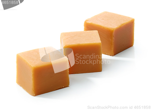 Image of caramel candies on white background