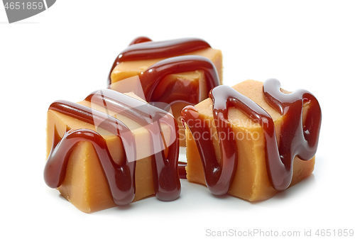 Image of caramel candies with chocolate sauce