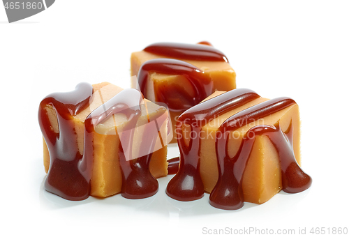 Image of caramel candies with chocolate sauce