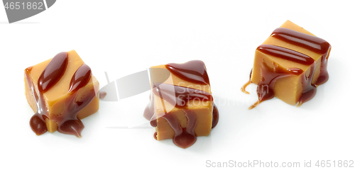 Image of caramel candies with chocolate sauce