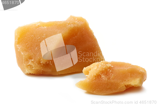 Image of caramel pieces on white background