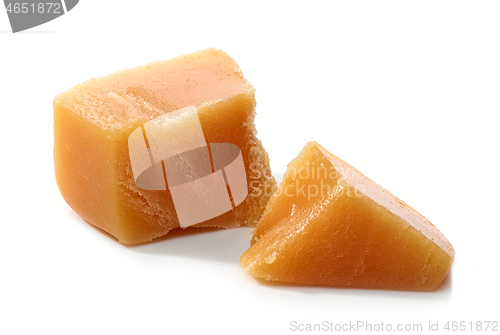 Image of caramel pieces on white background