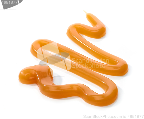 Image of melted caramel on white background