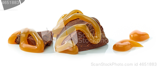 Image of chocolate pieces with melted caramel sauce