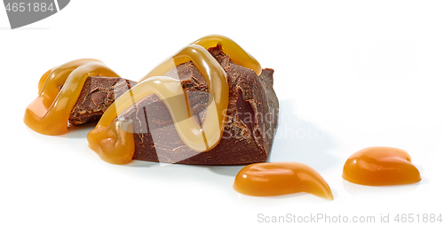 Image of chocolate pieces with melted caramel sauce