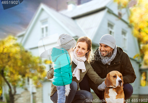 Image of happy family with dog over house in autumn