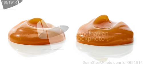 Image of melted caramel on white background