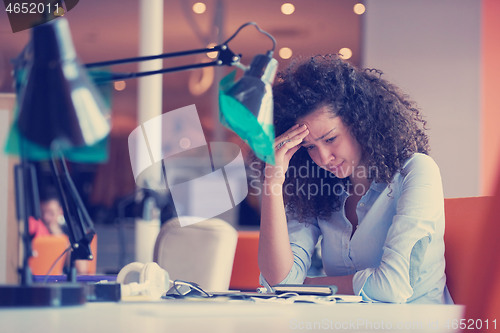 Image of young  business woman at office