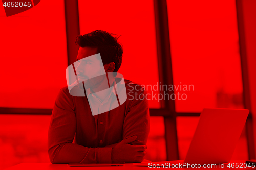 Image of happy young business man at office