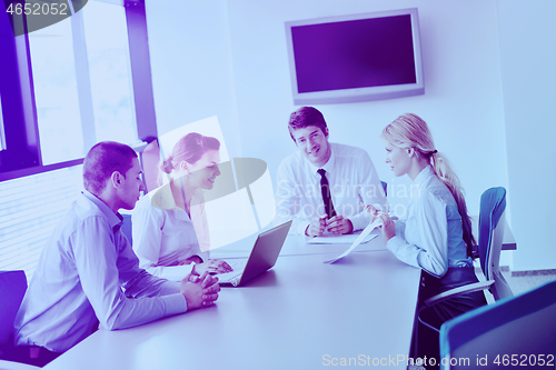 Image of business people in a meeting at office