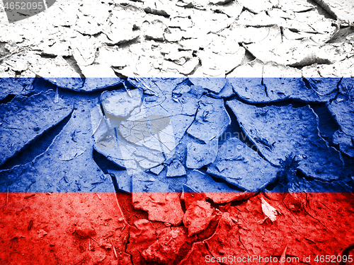 Image of Russian flag on dry cracked earth