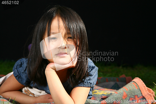 Image of Portrait of a young cute girl looking at the camera