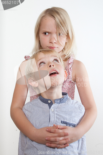 Image of Portrait of a brother and sister in studio