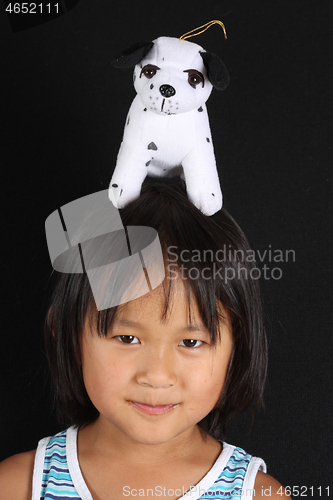 Image of Portrait of a young cute girl looking at the camera