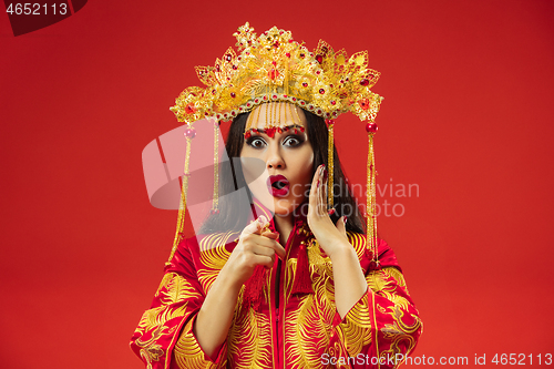 Image of Chinese traditional woman. Beautiful young girl wearing in national costume