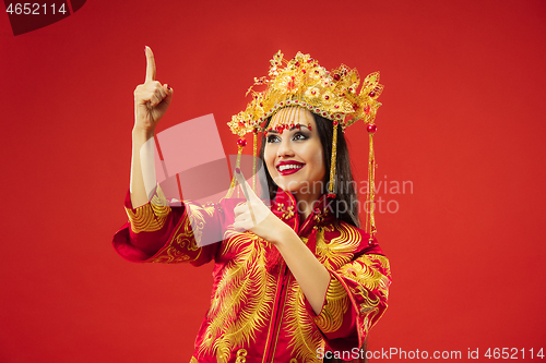 Image of Chinese traditional woman. Beautiful young girl wearing in national costume