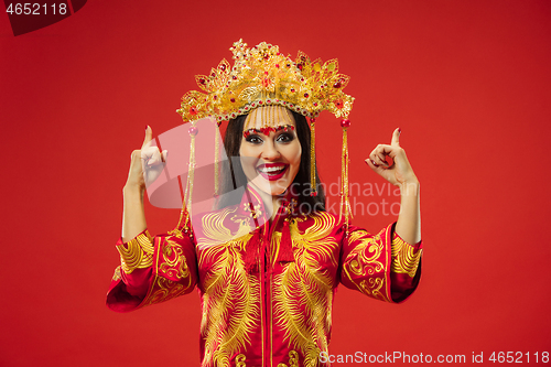 Image of Chinese traditional woman. Beautiful young girl wearing in national costume