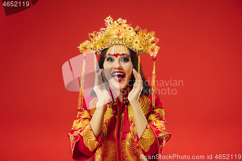 Image of Chinese traditional woman. Beautiful young girl wearing in national costume