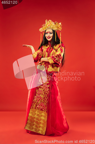 Image of Chinese traditional woman. Beautiful young girl wearing in national costume