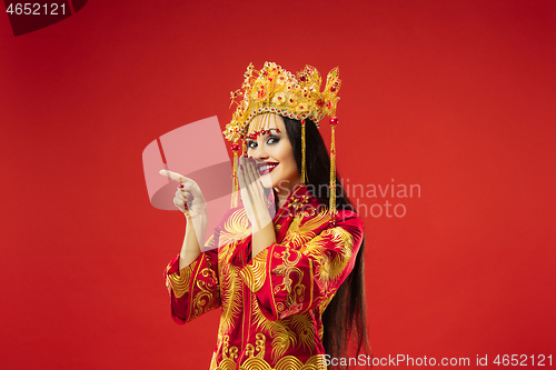 Image of Chinese traditional woman. Beautiful young girl wearing in national costume