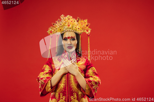 Image of Chinese traditional woman. Beautiful young girl wearing in national costume