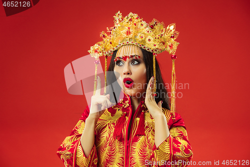 Image of Chinese traditional woman. Beautiful young girl wearing in national costume