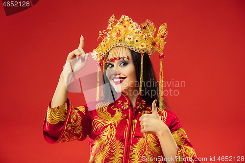 Image of Chinese traditional woman. Beautiful young girl wearing in national costume