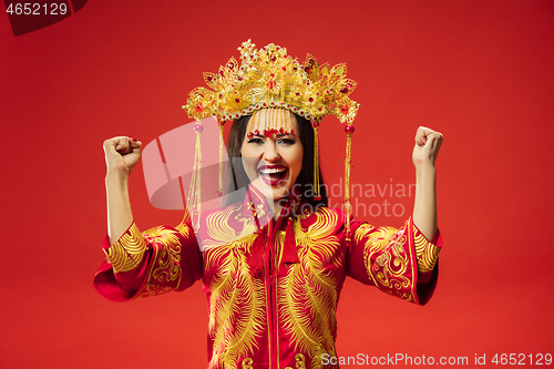 Image of Chinese traditional woman. Beautiful young girl wearing in national costume