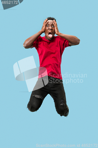 Image of The young attractive man looking suprised in Jumping