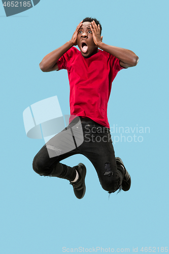 Image of The young attractive man looking suprised in Jumping
