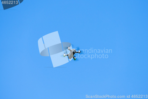 Image of toy drone blue sky background 