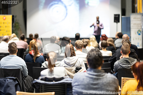 Image of Business speaker giving a talk at business conference event.