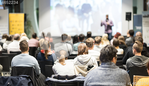 Image of Business speaker giving a talk at business conference event.