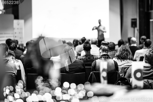 Image of Business speaker giving a talk at business conference event.