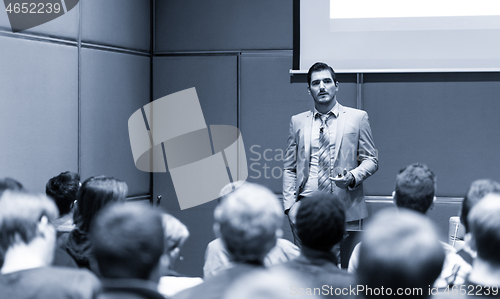 Image of Business speaker giving a talk at business conference meeting event.